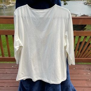 White T-shirt one X long sleeves trim around the neckline worn one time like new